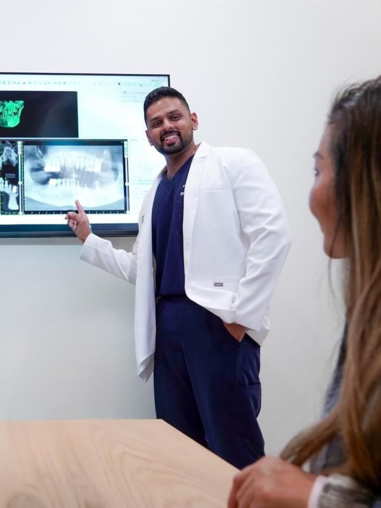 Dr. Fahim pointing at an xray